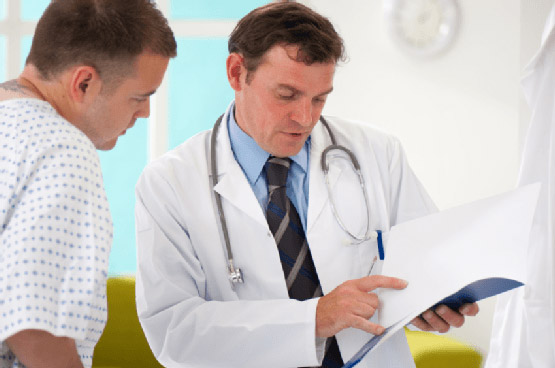 doctor discussing chart with patient