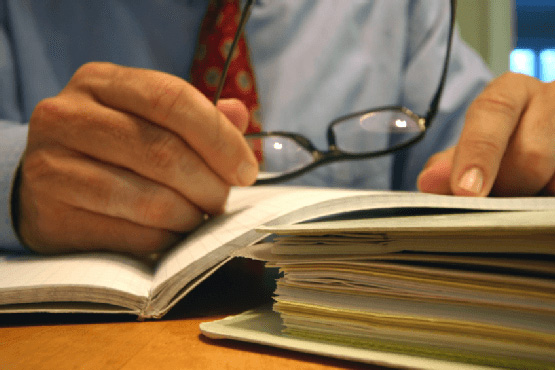 close-up of lawyer going over papers