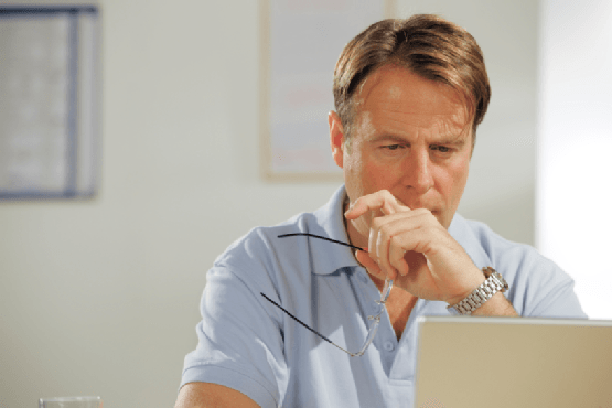 man doing research on a laptop